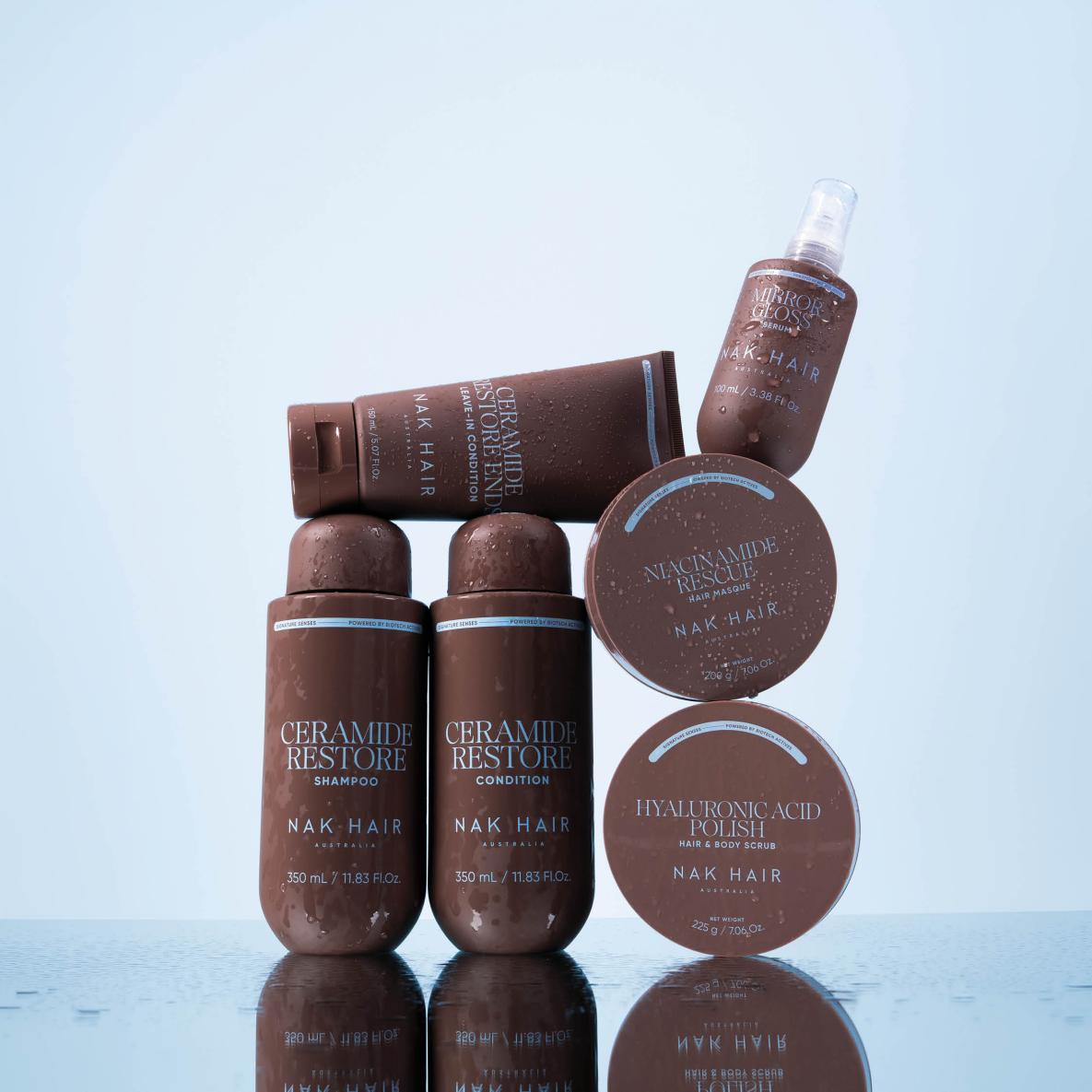 NAK Hair Products stacked on top of each other